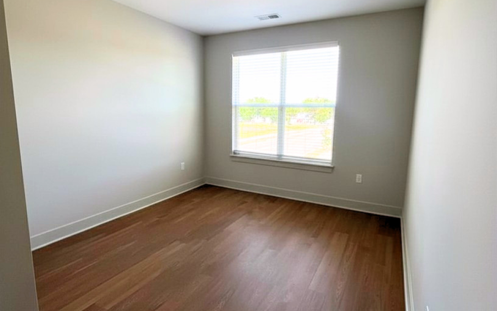 E2 - 3 bedroom floor plan layout with 2 bathrooms and 1375 square feet (Primary Bedroom)