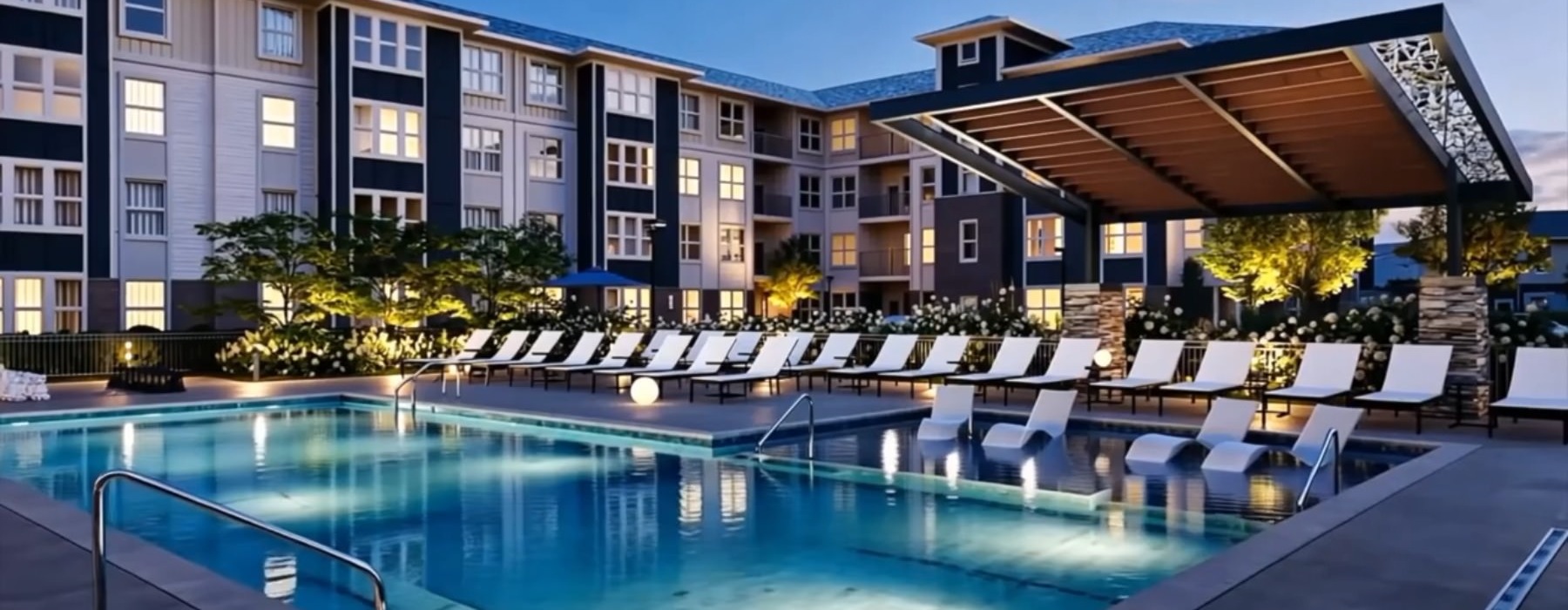 a swimming pool with lounge chairs