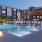 lounge chairs along swimming pool